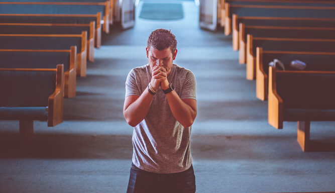 A man at the altar praying
